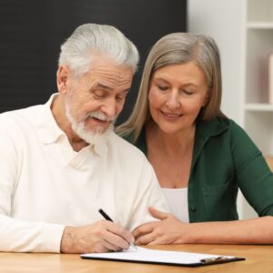 Couple Filling Out A Will